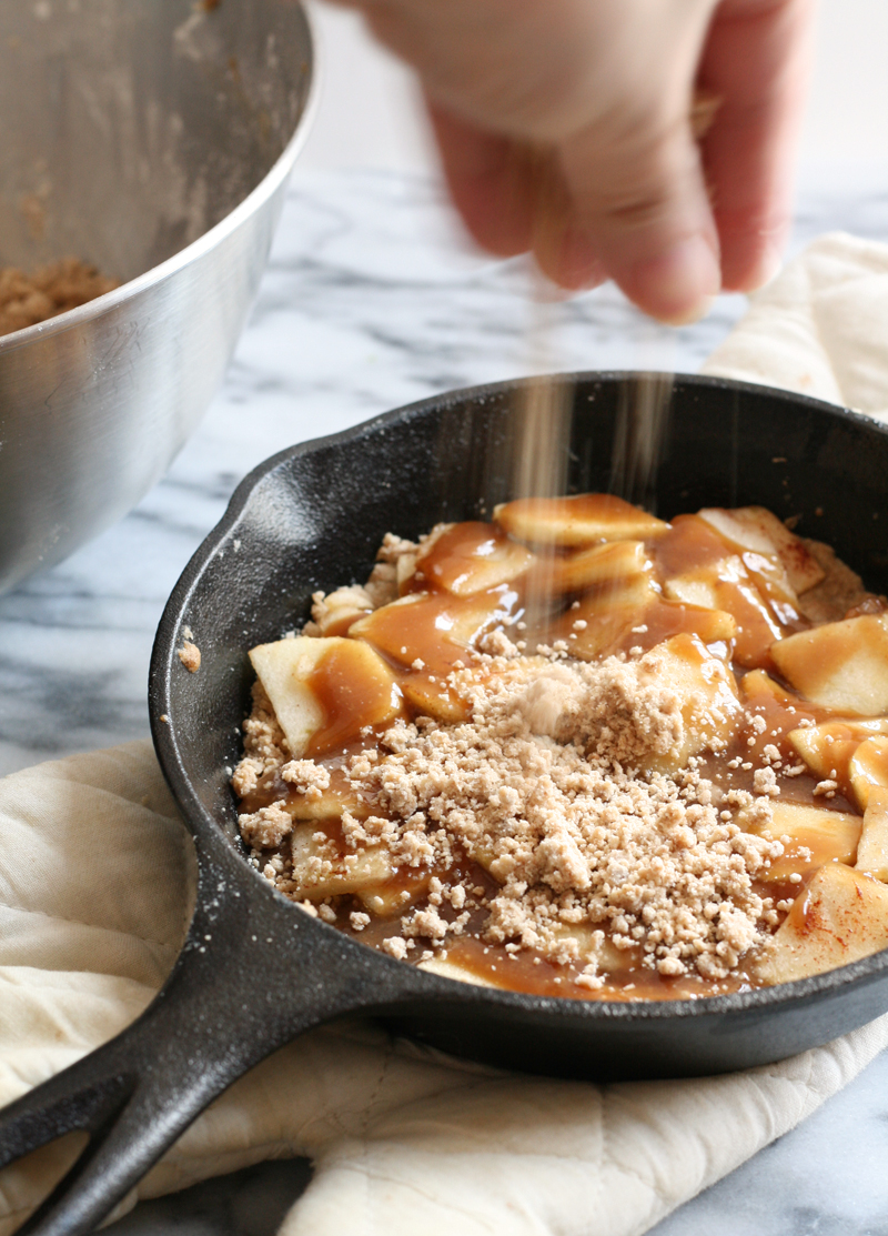 apple crumble with salted caramel sauce baked in skillet